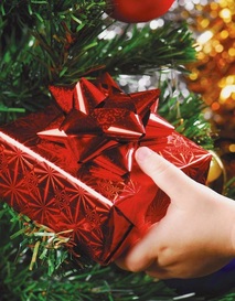 child giving christmas present